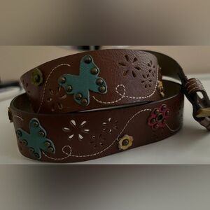 Colorful and adorable women’s belt with colorful butterfly and flower accents.